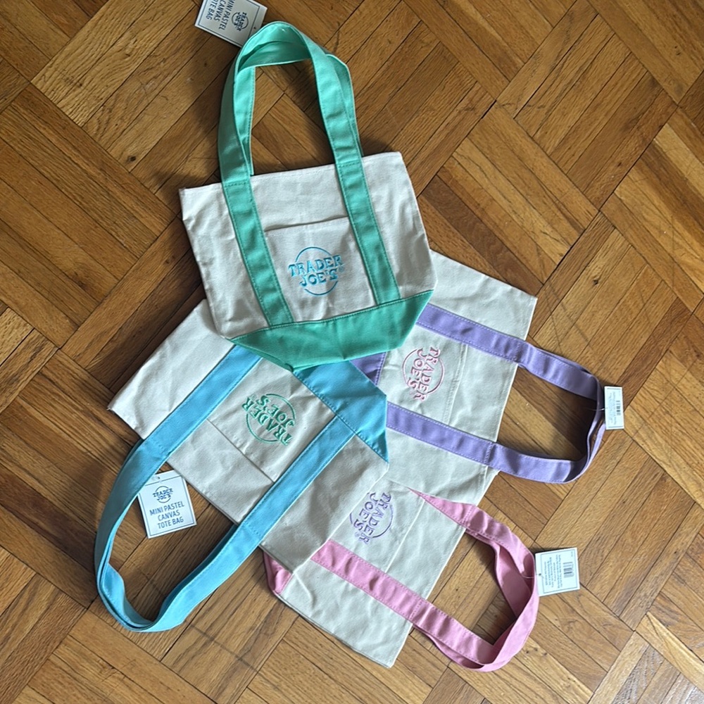 Four brand new with tag mini trader Joe canvas bag.